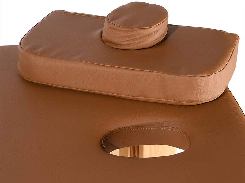 Kitama massage table with face cut-out, matching cover cushion and dark brown faux leather cover in H5 firmness